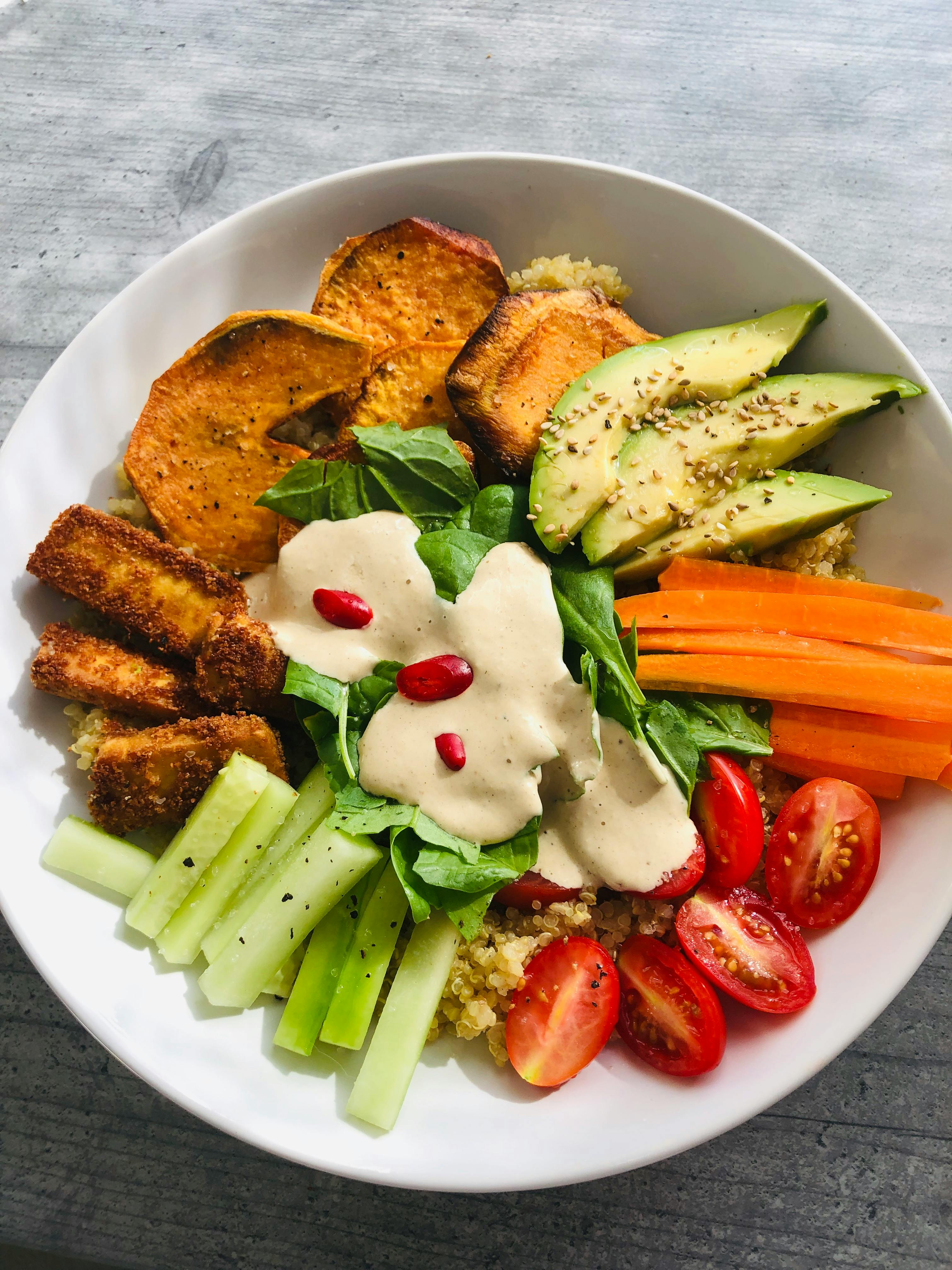Bowl with avocado, carrots, and fresh vegetables